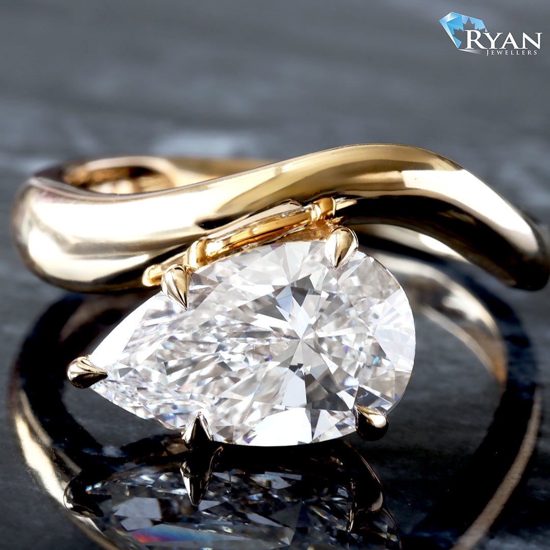 2.50ctw East West Pear Solitaire set on Curved High Polished Shoulders Ring