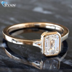 1.00ct Bezel Set Emerald Solitaire Slight Split Square Edge Shoulders Ring