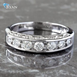 1.15ctw Graduated Channel Setting with Pave Bottom Round Cut French Beaded Band