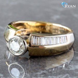 1.10CTW Round Bezel Center W/ Wide Graduated Channel Set Baguette Shoulders