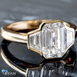 3.13ctw Bezel Set Three Stone Emerald Center and Trapezoid Sides on High Polished Shoulders Ring